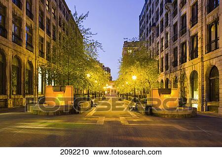 Stock Image - Le Royer Street In Old Montreal At Dusk; Montreal Quebec Canada. Fotosearch