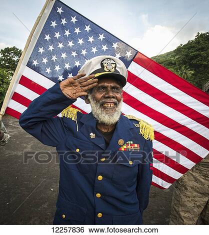 Leader of the Jon Frum Cargo cult saluting the American Flag; Tanna Island, Vanuatu View Large Photo Image Stock Photograph - Leader of the Jon Frum Cargo cult saluting the American Flag; Tanna Island, Vanuatu. Fotosearch