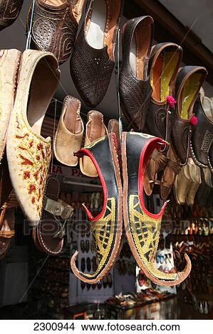 Leather shoes and other tourist goods for sale at this store/ shop near Hawa Mahal City Palace, Jaipur's most distinctive landmark, Jaipur, Rajasthan State, India. View Large Photo Image Picture - Leather shoes and other tourist goods for sale at this store/ shop near Hawa Mahal City Palace, Jaipur's most distinctive landmark, Jaipur, Rajasthan State, India.. Fotosearch