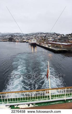 Leaving the harbour of Harstad onboard the Hurtigruten ship MS Nordlys, the largest town on the Vesteralen Islands; Norway View Large Photo Image Stock Photo - Leaving the harbour of Harstad onboard the Hurtigruten ship MS Nordlys, the largest town on the Vesteralen Islands; Norway. Fotosearch
