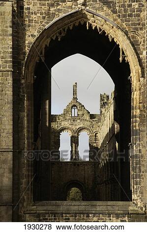 Stock Photo - Leeds, West Yorkshire, England. Kirkstall Abbey Is One Of The Countrys Largest Ruined Cistercian Monastaries, Dating From The 12Th Century. It Is Now A Museum. Kirkstall Abbey Was Often Painted By The Artist Jmw Turner.. Fotosearch