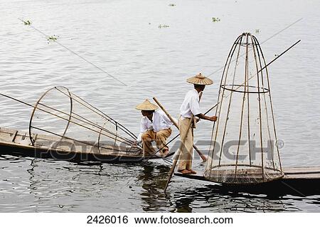 Leg rower fishermen on Inle Lake; Myanmar View Large Photo Image Stock Photograph - Leg rower fishermen on Inle Lake; Myanmar. Fotosearch