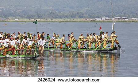 Leg rowing procession on Inle Lake; Myanmar View Large Photo Image Picture - Leg rowing procession on Inle Lake; Myanmar. Fotosearch