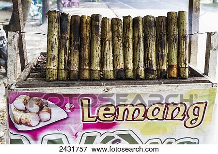 Lemang, traditional Indonesian food made of glutinous rice, coconut milk and salt that is cooked in a hollowed bamboo stick lined with banana leaves, Simalungun, North Sumatra, Indonesia View Large Photo Image Stock Photo - Lemang, traditional Indonesian food made of glutinous rice, coconut milk and salt that is cooked in a hollowed bamboo stick lined with banana leaves, Simalungun, North Sumatra, Indonesia. Fotosearch