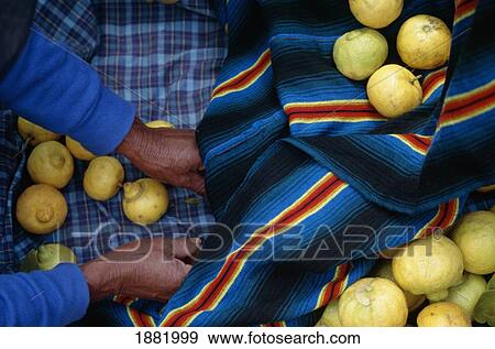 Stock Photo - Lemons And Traditional Woven Cloth At Market, Close Up. Fotosearch
