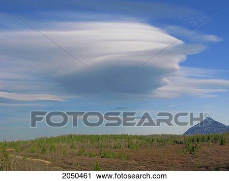 Stock Image - Lenticular Cloud Over St. Elias Mountain Near Haines Junction, Yukon. Fotosearch