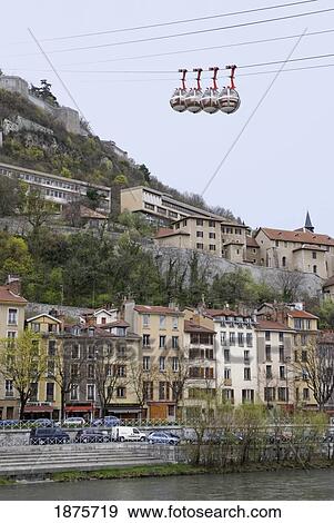 Les Bulles Cable Cars Over The Isère River; Grenoble, Isère, France View Large Photo Image Stock Photo - Les Bulles Cable Cars Over The Isère River; Grenoble, Isère, France. Fotosearch