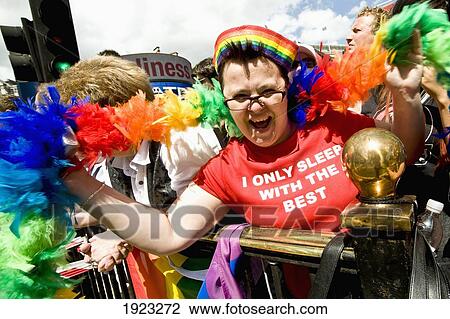 Stock Image - Lesbian Cheering At Gay Parade. Fotosearch