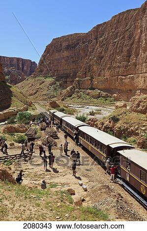 Lezard Rouge Train Runs From Metlaoui To Redeyef And Passes Through The Selja Gorge; Tunisia, North Africa View Large Photo Image Stock Image - Lezard Rouge Train Runs From Metlaoui To Redeyef And Passes Through The Selja Gorge; Tunisia, North Africa. Fotosearch