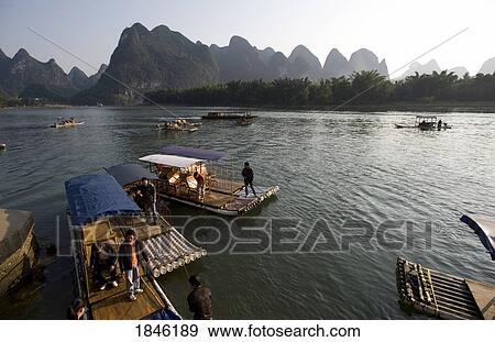 Stock Photo - Li River, Yangshuo, China; People In Traditional Chinese Boats. Fotosearch