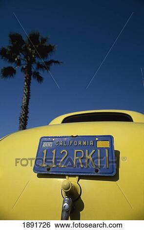 Stock Photograph - Licence Plate On Vintage Car, Low Angle View, Close Up. Fotosearch