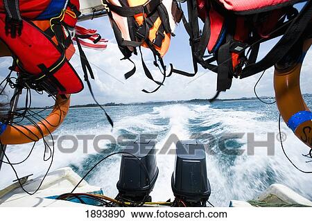 Life Jackets Hanging At Back Of Speedboat, With Wake On Water View Large Photo Image Stock Image - Life Jackets Hanging At Back Of Speedboat, With Wake On Water. Fotosearch