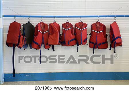 Life Jackets Hanging Next To An Indoor Swimming Pool View Large Photo Image Stock Photography - Life Jackets Hanging Next To An Indoor Swimming Pool. Fotosearch