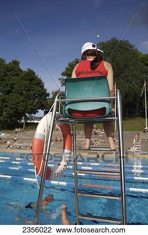 Lifeguard and swimmers at Frognerbadet, open-air pool; Oslo, Norway View Large Photo Image Stock Image - Lifeguard and swimmers at Frognerbadet, open-air pool; Oslo, Norway. Fotosearch