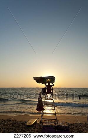 Lifeguard tower at sunset on beach; Goa, India View Large Photo Image Stock Photograph - Lifeguard tower at sunset on beach; Goa, India. Fotosearch