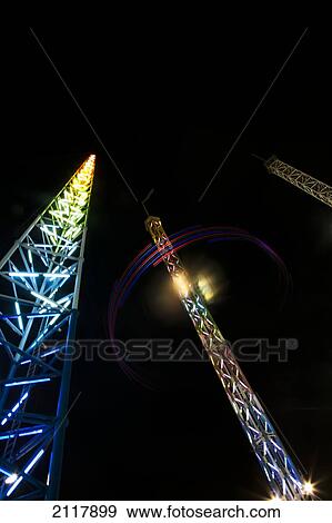 Light Illuminating Rides At A Carnival At Night; Orlando Florida United States Of America View Large Photo Image Stock Photo - Light Illuminating Rides At A Carnival At Night; Orlando Florida United States Of America. Fotosearch