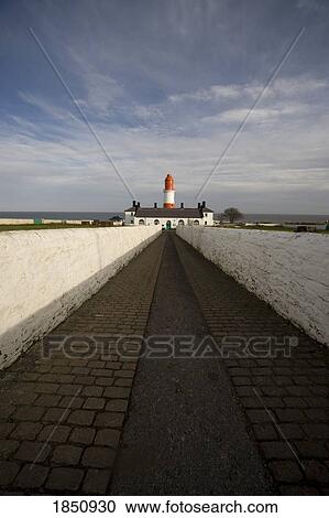 Stock Image - Lighthouse At End Of Walkway; Tyne And Wear, England. Fotosearch