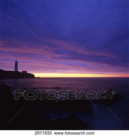 Stock Image - Lighthouse At Sunrise, Cap-Des-Rosiers, Gaspe Peninsula, Quebec. Fotosearch