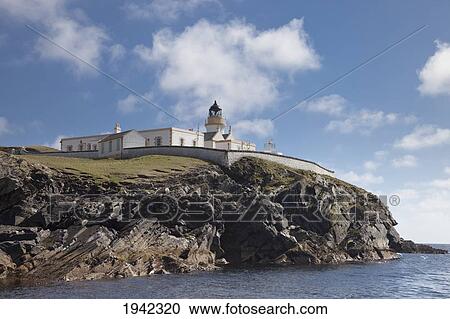 Stock Image - Lighthouse On Cliff; Bressay Scotland. Fotosearch