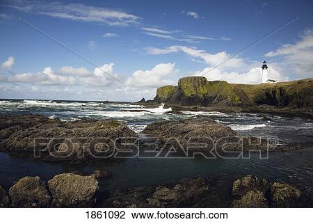 Lighthouse On Rocky Seashore; Oregon Coast, Oregon, Usa View Large Photo Image Stock Image - Lighthouse On Rocky Seashore; Oregon Coast, Oregon, Usa. Fotosearch