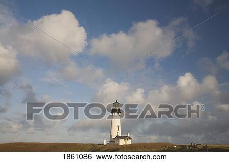 Stock Photograph - Lighthouse With Cloudy Backdrop. Fotosearch