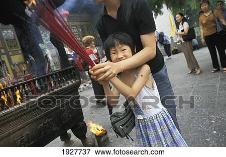 Stock Photo - Lighting Incense, Big Wild Goose Pagoda; Xi'an, Shaanxi Province, China. Fotosearch