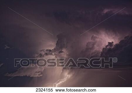 Stock Photography - Lightning arcs between clouds during a storm; Saskatchewan, Canada. Fotosearch