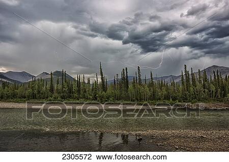Stock Image - Lightning Streaks Over The Ogilvie Mountains Along The Blackstone River And Dempster Highway; Yukon Canada. Fotosearch