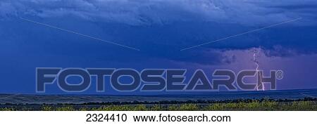 Stock Image - Lightning strike over the prairies; Saskatchewan, Canada. Fotosearch