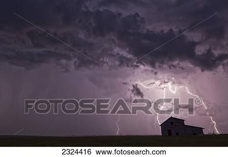 Lightning strikes over the prairies as it approaches an old abandoned farm house; Val Marie, Saskatchewan, Canada View Large Photo Image Stock Photograph - Lightning strikes over the prairies as it approaches an old abandoned farm house; Val Marie, Saskatchewan, Canada. Fotosearch