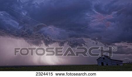 Lightning strikes over the prairies as it approaches an old abandoned farm house; Val Marie, Saskatchewan, Canada View Large Photo Image Stock Photography - Lightning strikes over the prairies as it approaches an old abandoned farm house; Val Marie, Saskatchewan, Canada. Fotosearch