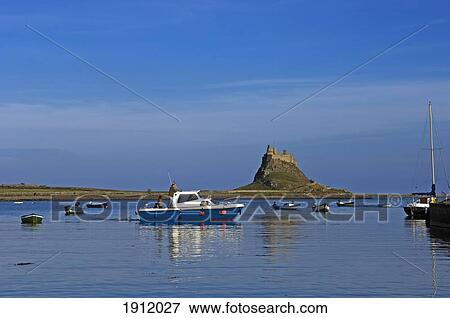 Stock Photo - Lindesfarne Castle And Boats, Holy Island, Northumberland, Uk. Fotosearch