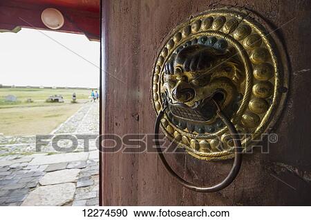 Lion-shaped door knocker on a door of the Dalai Lama Temple in the Erdene Zuu Monastery, Karakorum (Kharkhorin),? v÷rkhangai Province, Mongolia View Large Photo Image Stock Image - Lion-shaped door knocker on a door of the Dalai Lama Temple in the Erdene Zuu Monastery, Karakorum (Kharkhorin),? v÷rkhangai Province, Mongolia. Fotosearch