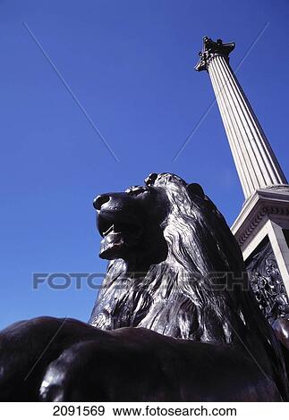 Stock Photo - Lion Statue Beneath Nelsons Column, Trafalgar Square. London, Uk.. Fotosearch