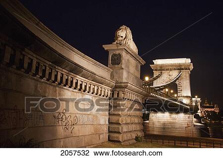 Lion Statue Of The Szechenyi Chain Bridge Over The Danube River At Night, Budapest, Hungary View Large Photo Image Stock Image - Lion Statue Of The Szechenyi Chain Bridge Over The Danube River At Night, Budapest, Hungary. Fotosearch