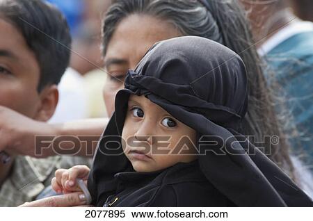 Stock Photography - Little Boy Dressed In Mourning At The Holy Burial Procession On Good Friday In Antigua Guatemala, Sacatep. Fotosearch