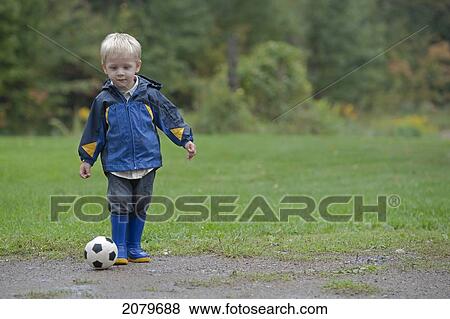 Little Boy Playing With Soccer Ball View Large Photo Image Stock Photo - Little Boy Playing With Soccer Ball. Fotosearch