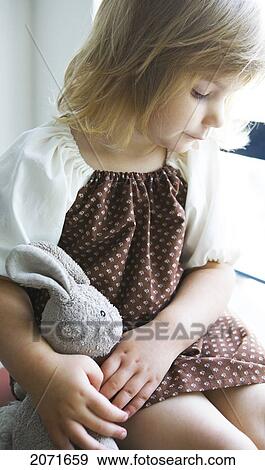 Little Girl Holding A Stuffed Bunny, Vancouver, British Columbia View Large Photo Image Stock Photo - Little Girl Holding A Stuffed Bunny, Vancouver, British Columbia. Fotosearch