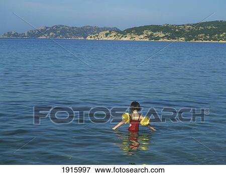 Little Girl In Water At The Beach View Large Photo Image Stock Photo - Little Girl In Water At The Beach. Fotosearch