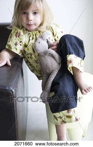 Little Girl On A Stool Holding A Stuffed Bunny, Vancouver, British Columbia View Large Photo Image Stock Image - Little Girl On A Stool Holding A Stuffed Bunny, Vancouver, British Columbia. Fotosearch