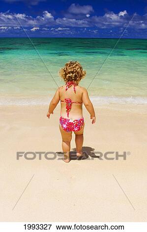 Little Girl With Blond Curly Hair Plays On The Beach View Large Photo Image Stock Photo - Little Girl With Blond Curly Hair Plays On The Beach. Fotosearch
