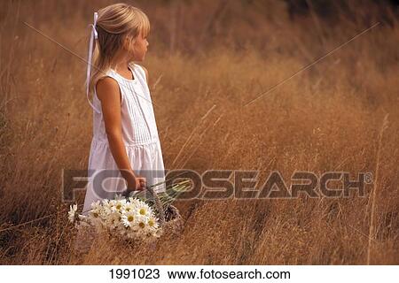 Little Girl With Flowers In Basket, Straw Field View Large Photo Image Stock Image - Little Girl With Flowers In Basket, Straw Field. Fotosearch