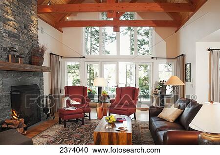 Living Room With Fireplace Of Home With An Ocean View; Mayne Island, British Columbia, Canada View Large Photo Image Stock Image - Living Room With Fireplace Of Home With An Ocean View; Mayne Island, British Columbia, Canada. Fotosearch