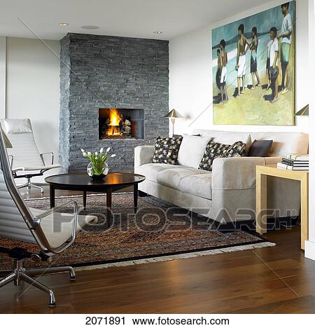 Stock Image - Living Room With Stone Fireplace And Modern Furniture. Fotosearch
