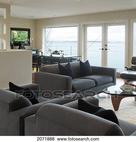 Living Room/Dining Room With Ocean View And Grey Furniture View Large Photo Image Stock Photo - Living Room/Dining Room With Ocean View And Grey Furniture. Fotosearch