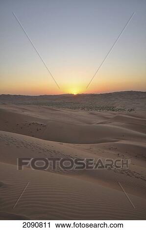 Stock Image - Liwa Desert Dune At Sunset In Empty Quarter, Abu Dhabi. Fotosearch
