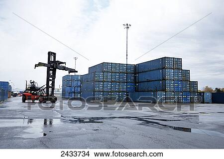 Loader and freight at Bickerdike Pier in Old Montreal; Montreal, Quebec, Canada View Large Photo Image Picture - Loader and freight at Bickerdike Pier in Old Montreal; Montreal, Quebec, Canada. Fotosearch