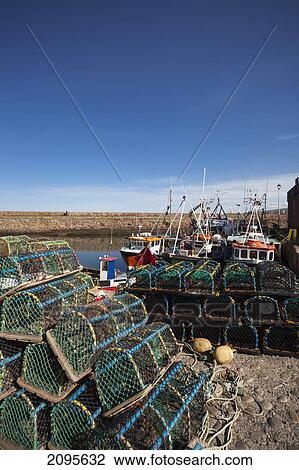 Lobster Cages Piled Along The Water's Edge; Dunbar Scottish Borders Scotland View Large Photo Image Stock Image - Lobster Cages Piled Along The Water's Edge; Dunbar Scottish Borders Scotland. Fotosearch
