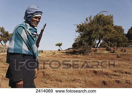 Local armed guard with trekking group, Simien Mountains National Park; Asmara region, Ethiopia View Large Photo Image Stock Photo - Local armed guard with trekking group, Simien Mountains National Park; Asmara region, Ethiopia. Fotosearch