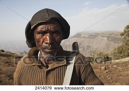 Stock Photo - Local armed guard with trekking group, Simien Mountains National Park; Amhara region, Ethiopia. Fotosearch